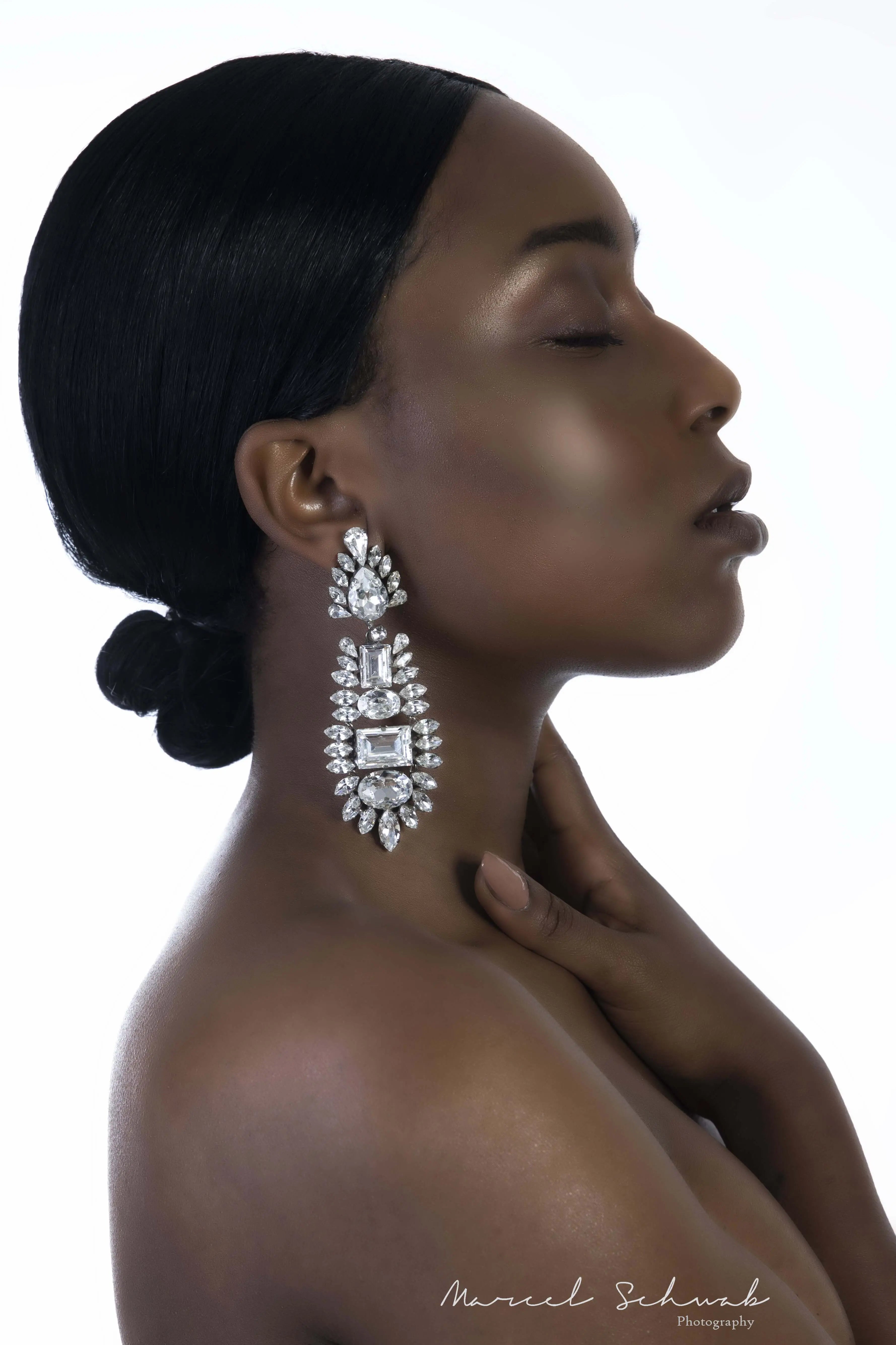 Luxury chandelier earrings made with Swarovski crystals by the model Sensemielja Letitia Sumter