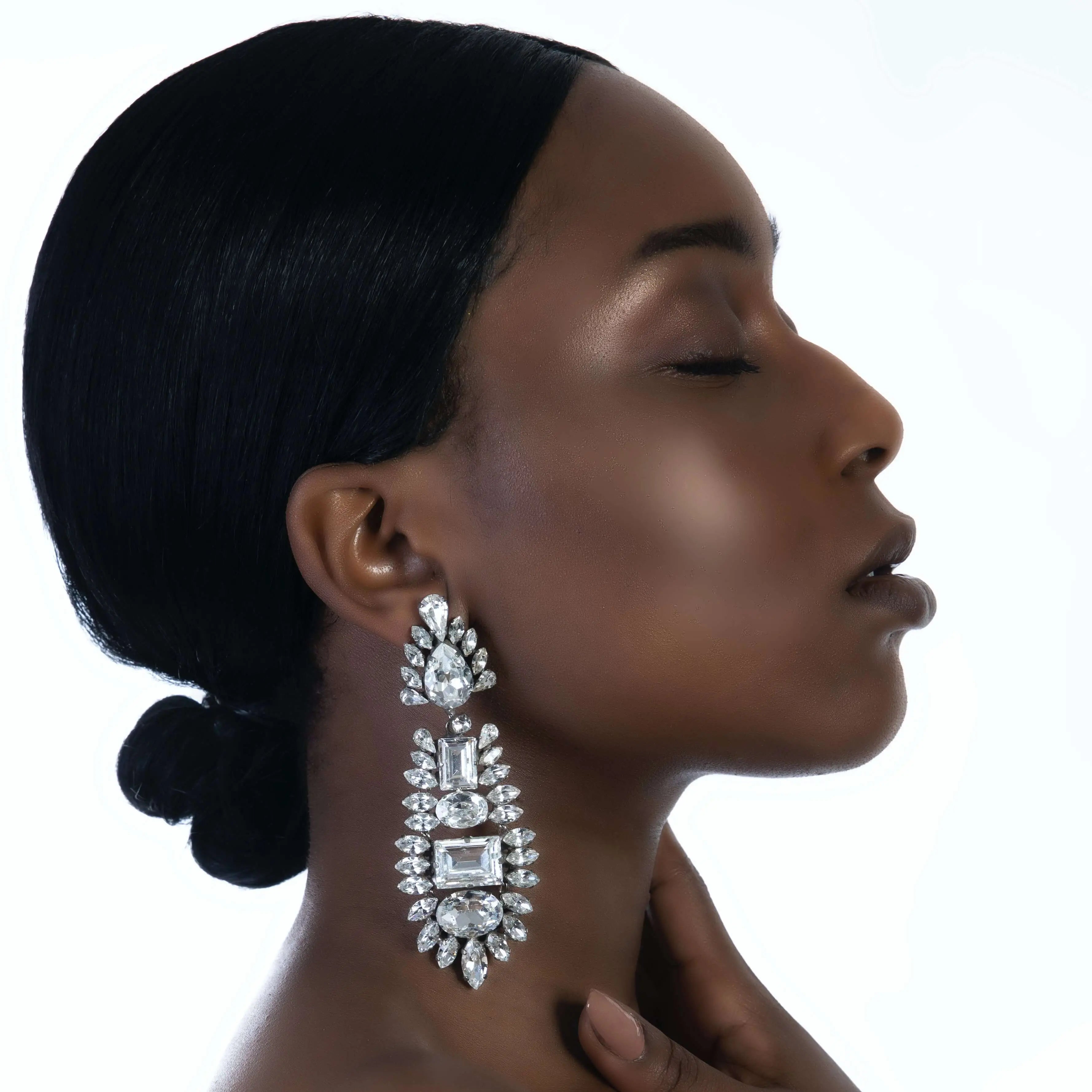 Luxury chandelier earrings made with Swarovski crystals by the model Sensemielja Letitia Sumter